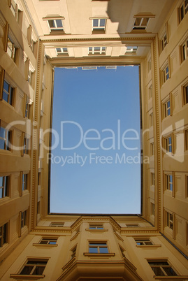 Blue sky framed by building