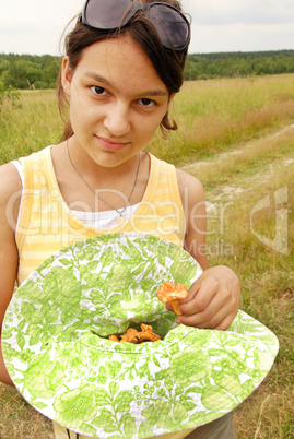 Teenage girl with mushrooms