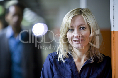 Smart casual caucasian female portrait in garage with light reflections