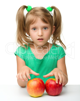 Portrait of a little girl with apple