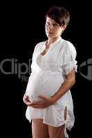 Pregnant young woman in a white shirt