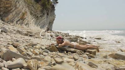 Girl lying on the beach