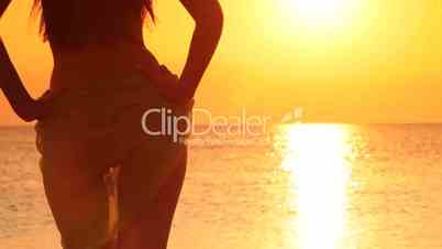 Bikini Model with Sarong looking at sunset