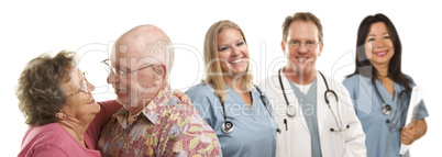 Senior Couple with Medical Doctors or Nurses Behind