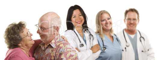 Senior Couple with Medical Doctors or Nurses Behind