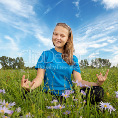 yoga young woman on green grass