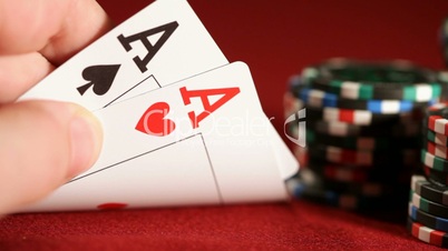 Stack of chips and two aces