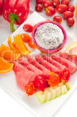 mixed plate of fresh sliced fruits