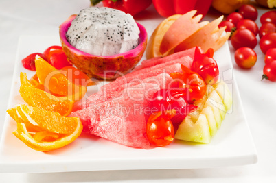 mixed plate of fresh sliced fruits