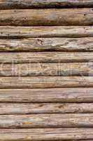 Wooden logs wall of rural house background