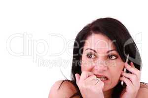 afraid looking woman with a phone isolated on white