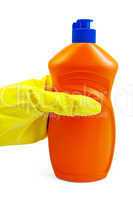 A bottle of orange in yellow-gloved hand in the