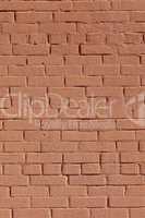 Background with old red painted brick wall