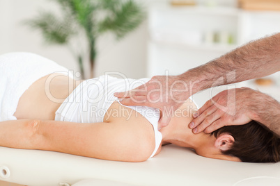 Man massaging a woman's neck