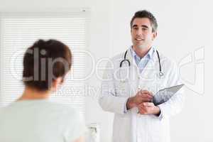 Doctor talking to a cute woman