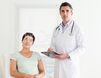 Doctor and patient looking into a camera