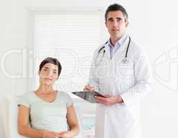 Doctor and patient looking into a camera