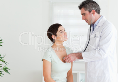 Doctor examining a woman