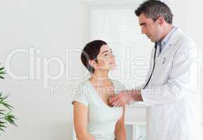 Doctor examining a woman