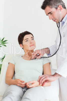 Doctor examining a female patient