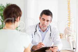 Doctor explaining something to a woman