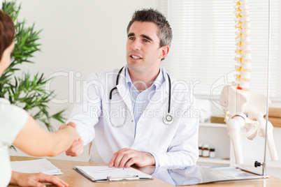 Doctor greeting a patient