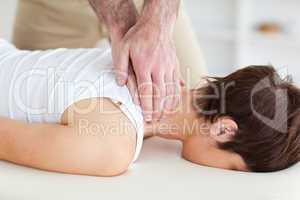 Masseur massaging customer's neck
