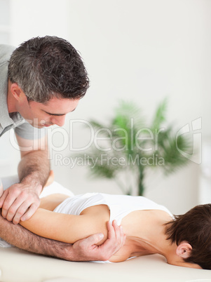 Woman getting a shoulder-stretching