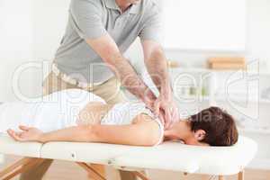 Guy massaging a cute woman's neck