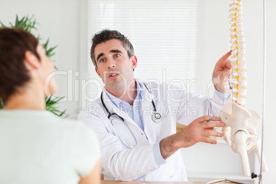 Male Doctor explaining something to a woman