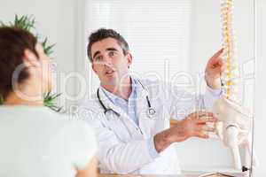 Male Doctor explaining something to a woman