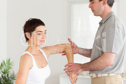 Chiropractor working on a woman's arm