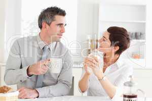 Happy couple drinking coffee