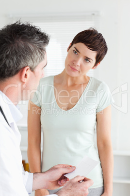 Close up of a Beautiful Woman receiving a prescription