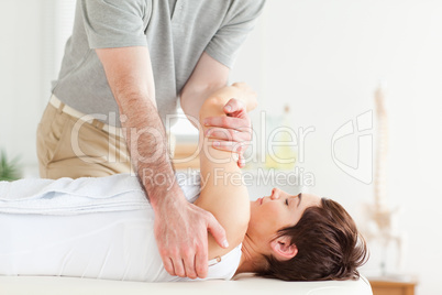 Man stretching a woman's arm