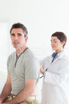 Doctor examining a patient with a stethoscope