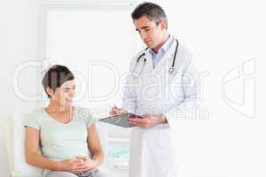 Charming Woman lying down talking to a doctor