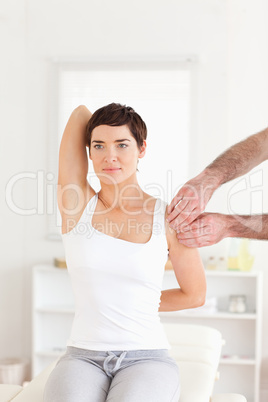 Female Patient doing some exercises under supervision