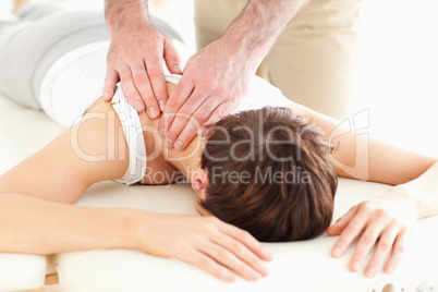 Man massaging a woman's neck