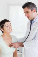 Close up of a Doctor examining a brunette woman