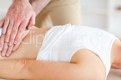Lying Woman getting a massage