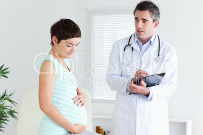 Pregnant woman visiting her doctor