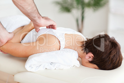 Gorgeous Woman getting a shoulder-massage