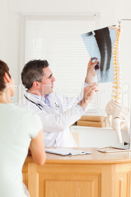 Doctor showing a patient a x-ray