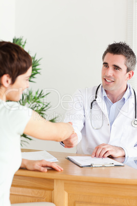 Male Doctor greeting a patient