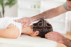 Handsome Man massaging a woman's neck