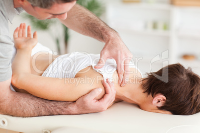 Man massaging a woman's shoulder