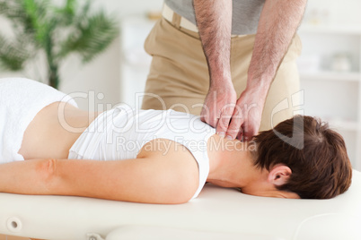 Masseur massaging a customer's neck