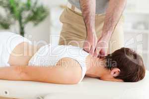 Masseur massaging a customer's neck