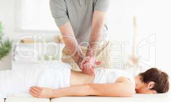Charming Woman relaxing during a back-massage